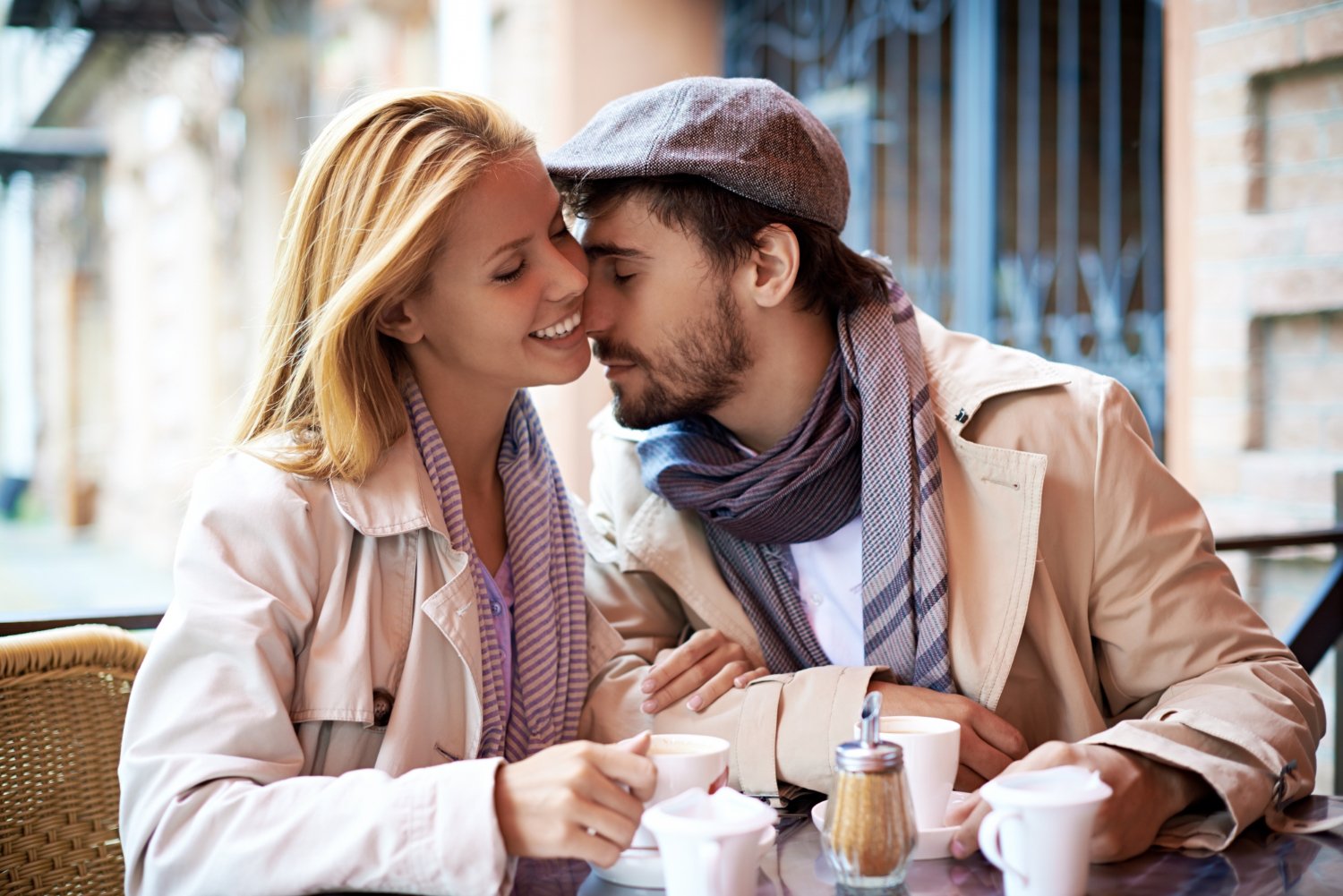 A couple reconnecting over coffee at a café