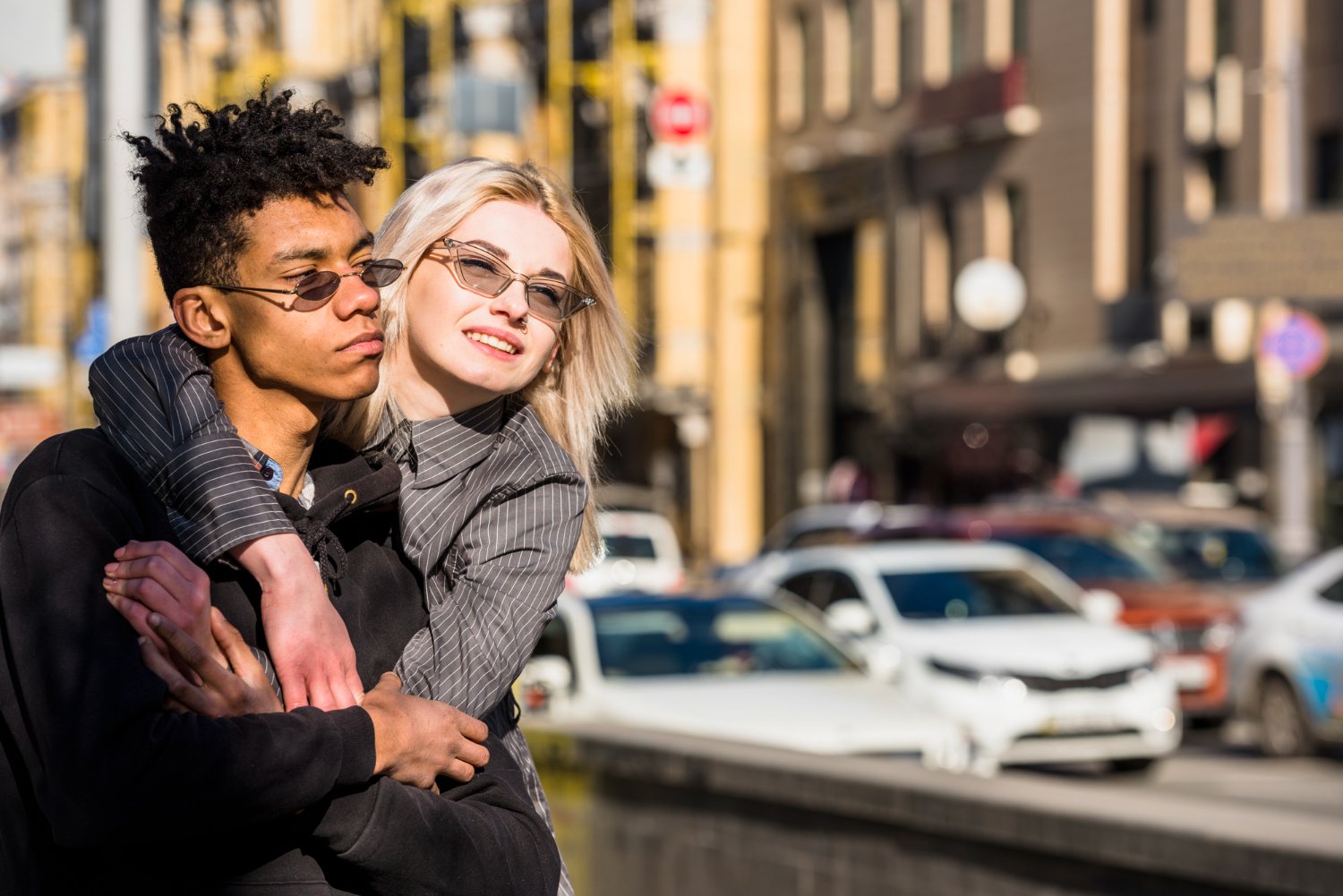 A couple sharing a close moment on a New York City street